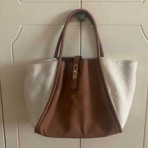 Women’s hobo bag tan man made material with fun fur on the sides